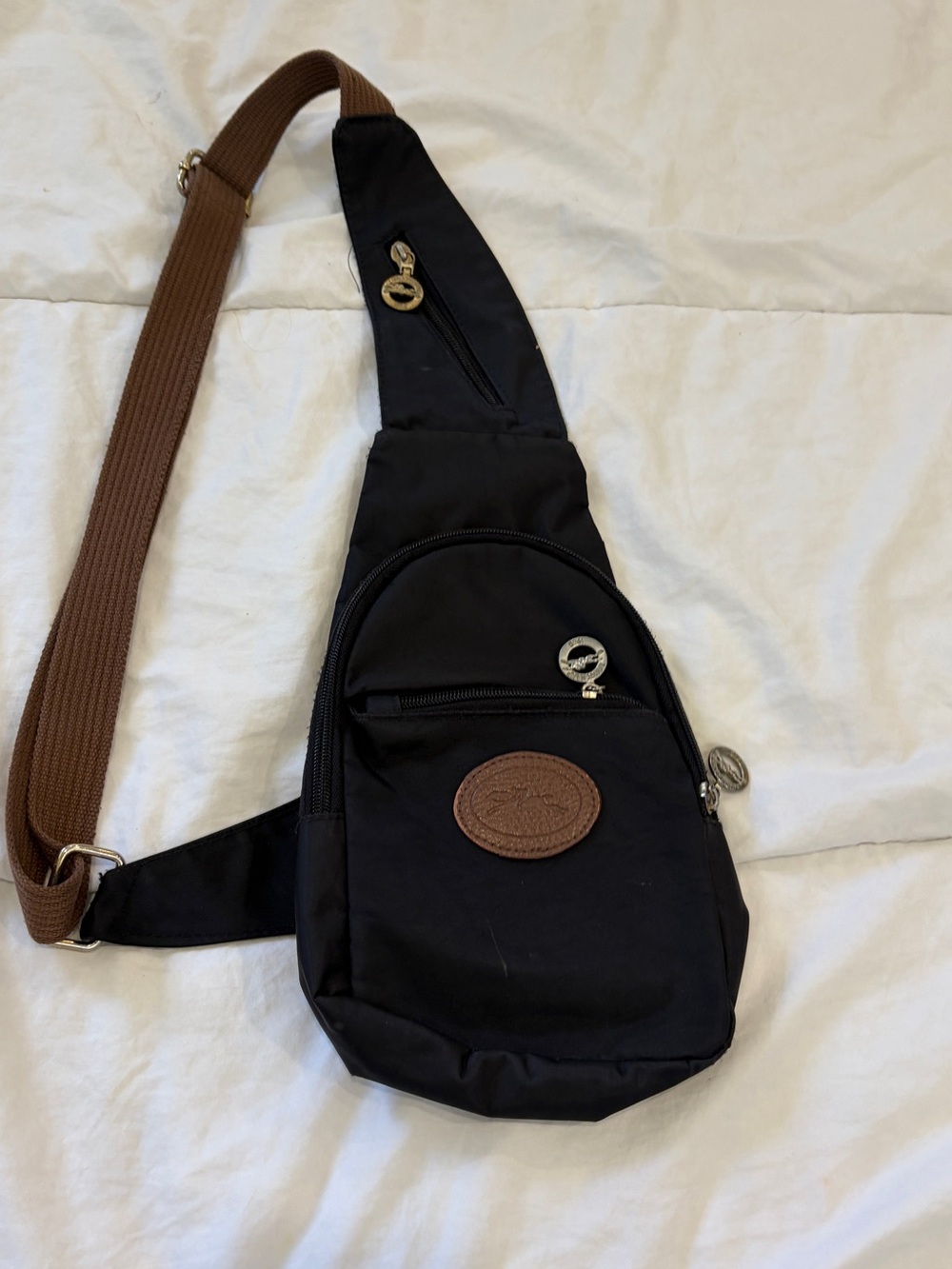 vintage Longchamp nylon sling backpack or chest bag.